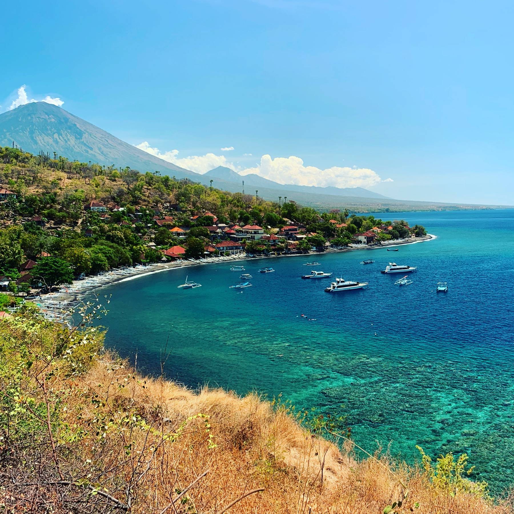 Turquoise bay of Amed with Mount Agung in the background